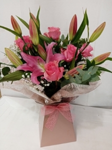 Pink rose and lily hand tied